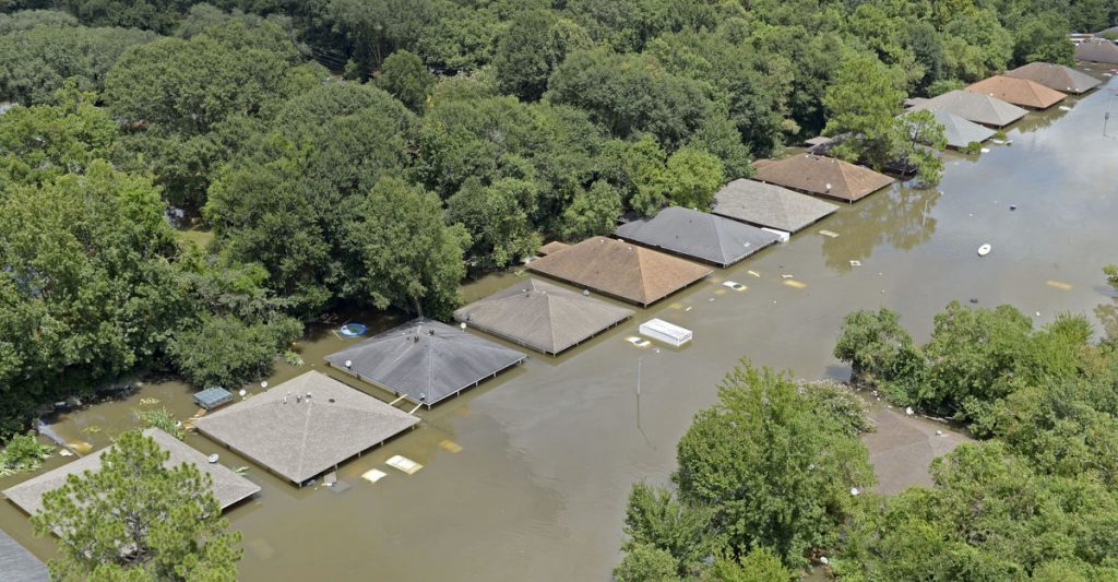 Water is up to the roofs in a subdivision of Joor Road. Aerials of severe weather flooding in East Baton Rouge Parish on Monday Aug. 15, 2016.