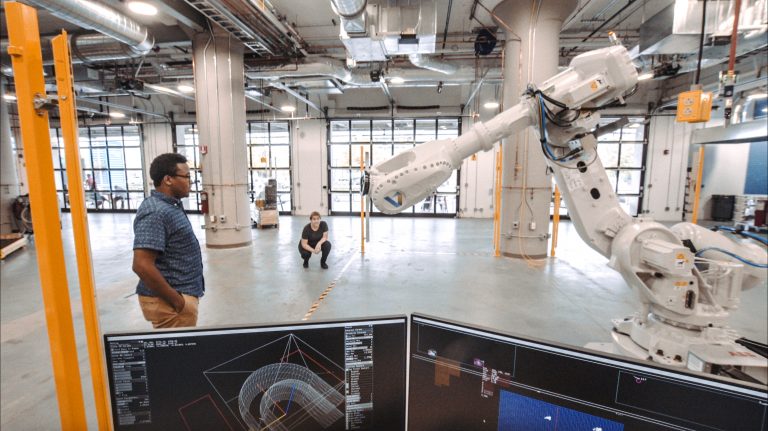 A research team in the Autodesk BUILD Space explores human-robot interaction.