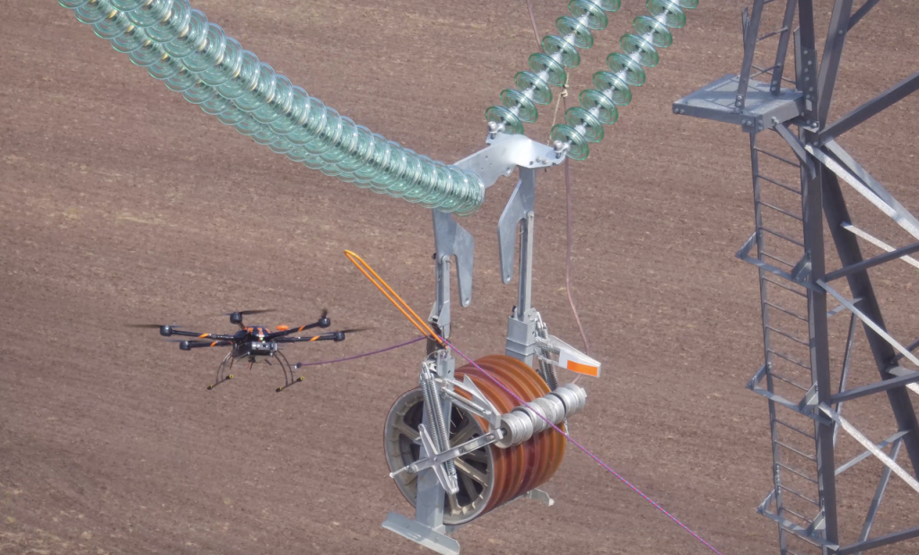 Drones are replacing helicopters in pulling transmission lines
